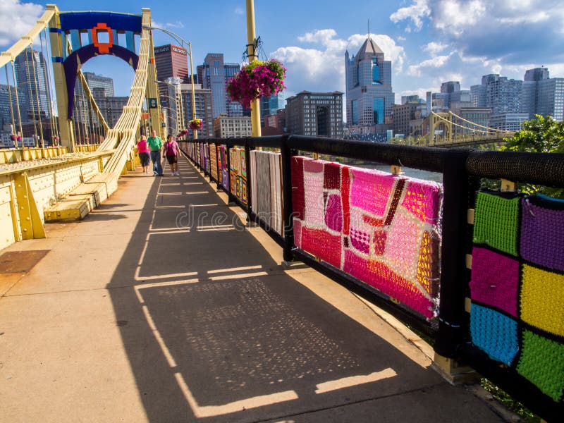 Textile Arts on Pittsburgh Bridge with People Walking Across Editorial