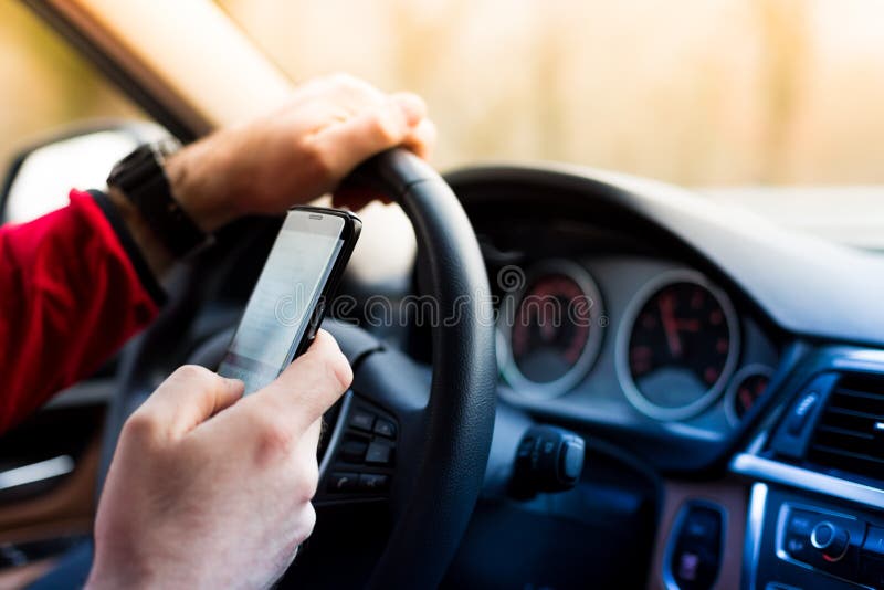 Dangerous texting and driving at the same time. Dangerous texting and driving at the same time