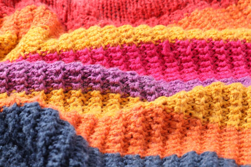 Textur aus buntem Strickstoff als Hintergrund stockbild