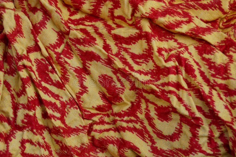 Textura amarela vermelha da cor do pano amarrotado foto de stock Textura amarela vermelha da cor do pano amarrotado foto de stock