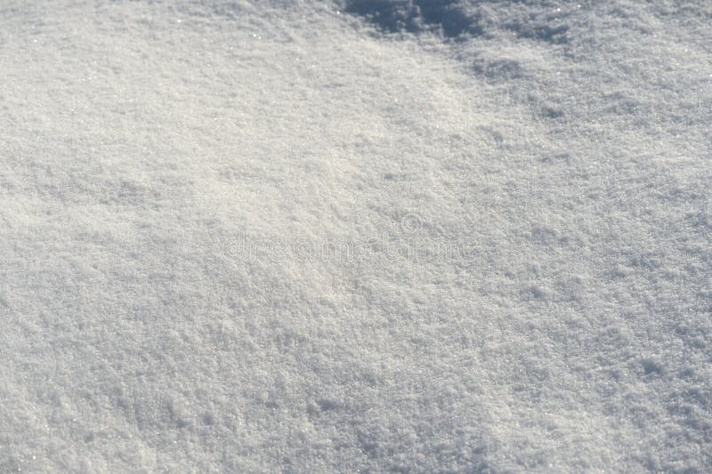 Textura blanca de la nieve en un día soleado Fondo del invierno foto de archivo Textura blanca de la nieve en un día soleado Fondo del invierno foto de archivo