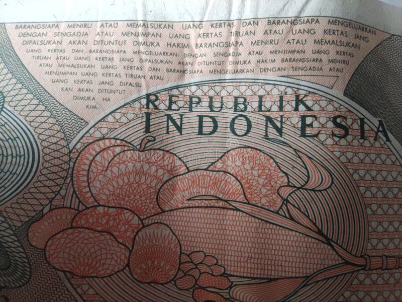 Textura de moeda antiga indonésia com escrita legal fotografia de stock