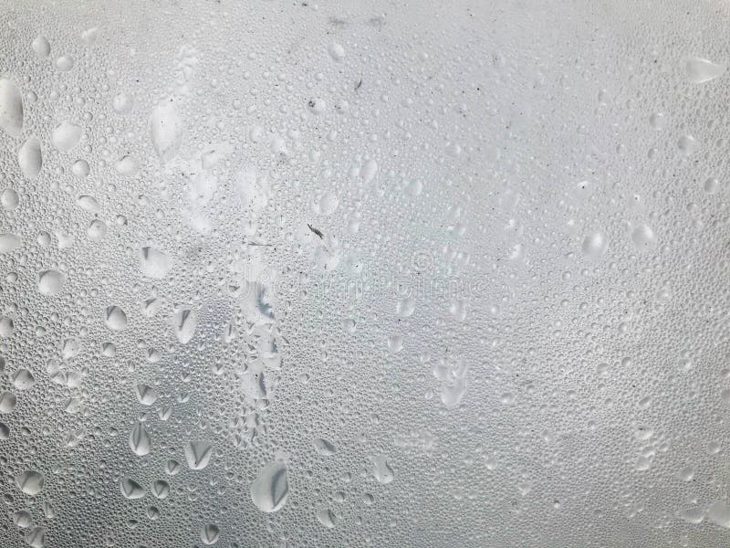 Texture of silvery color. plastic wrap with drops of steam on top. unusual natural texture, vaporization of gases. wet texture, stylish unusual color background. Texture of silvery color. plastic wrap with drops of steam on top. unusual natural texture, vaporization of gases. wet texture, stylish unusual color background