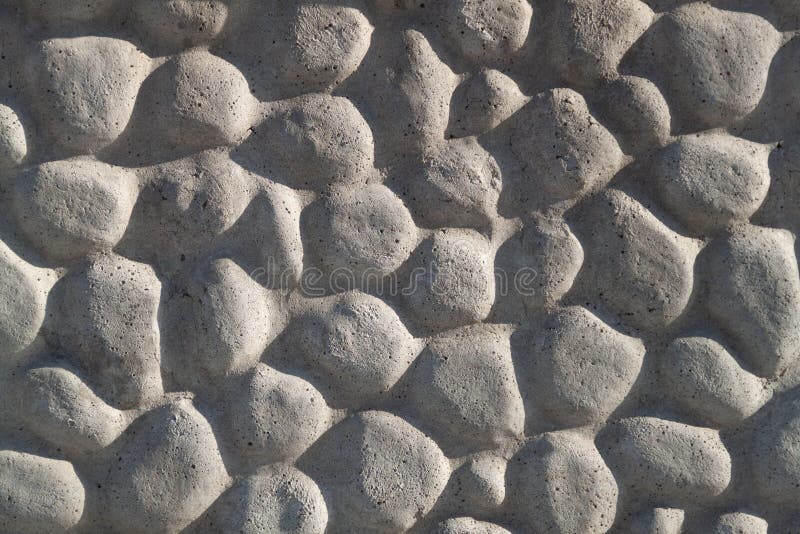 Cerca decorativa de pedra a granel na grade fundo texturizado de uma parede  de pedra com rede de ferro parede de pedra em armação de arame gabião  preenchido com calcário