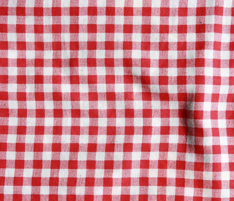 Textura de uma cobertura quadriculado vermelha e branca do piquenique fotos de stock Textura de uma cobertura quadriculado vermelha e branca do piquenique fotos de stock