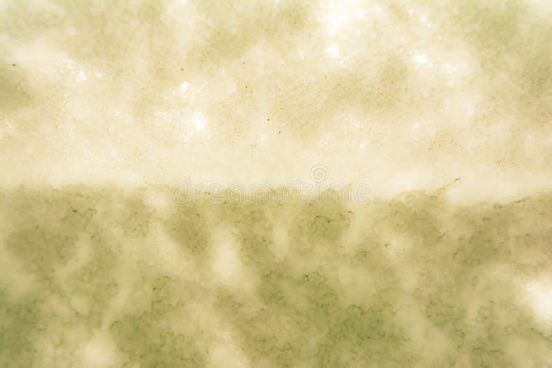 Textura de una superficie abstracta cavernosa áspera, ackground borroso foto de archivo libre de regalías Textura de una superficie abstracta cavernosa áspera, ackground borroso foto de archivo libre de regalías