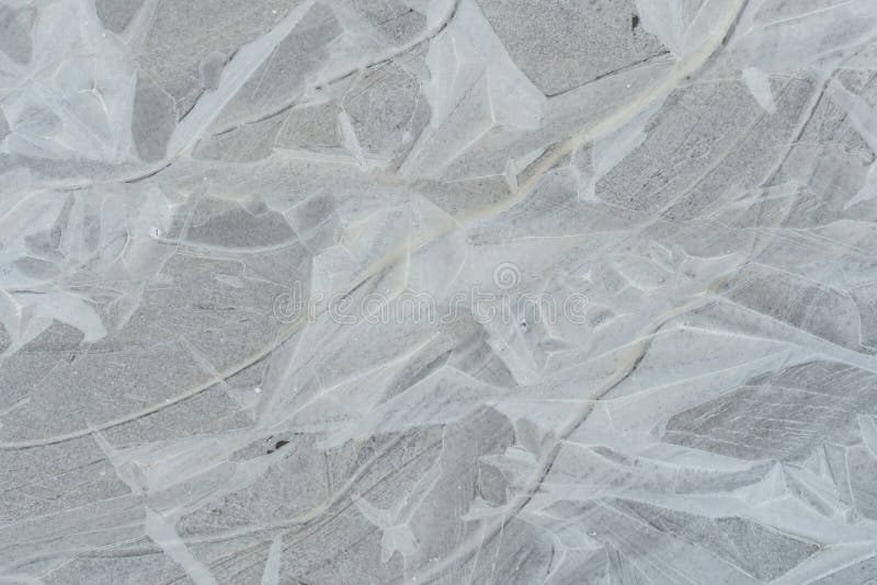 Textura del hielo en un charco de fango imagen de archivo libre de regalías Textura del hielo en un charco de fango imagen de archivo libre de regalías