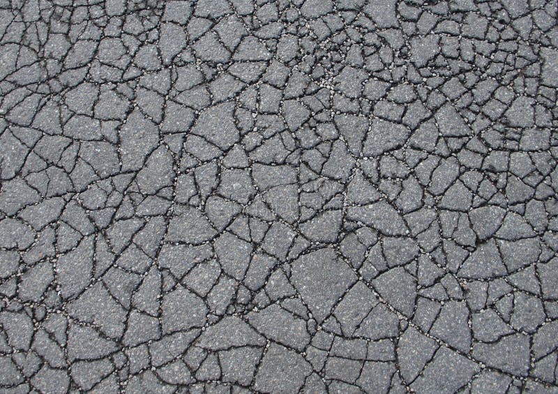 Textura gris del asfalto quebrada