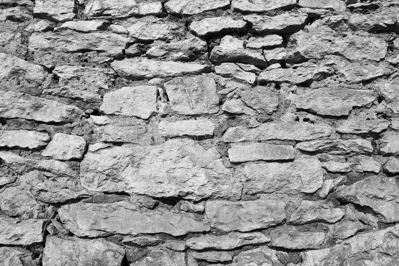 Textura preto e branco da parede de pedra fotografia de stock Textura preto e branco da parede de pedra fotografia de stock