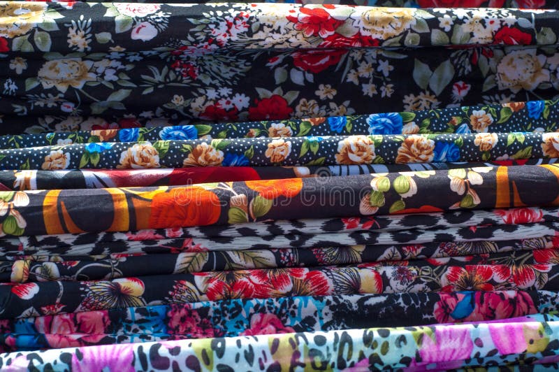 Texture Background, Pattern. Different Fabrics Stacked on a Table in a ...