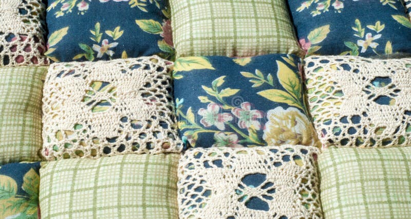 Texture background, pattern. Different fabrics stacked on a table in a pile