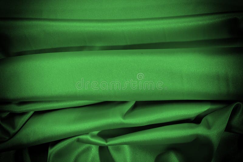 Texture, background, pattern. Fabric silk is dark green. Express royalty free stock image
