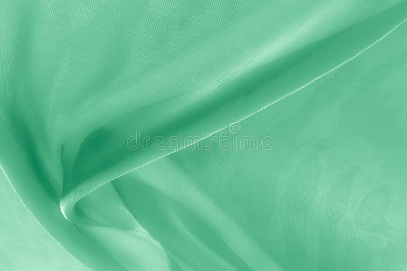 Texture, background, pattern. Pale green silk fabric. It is very stock image