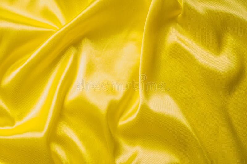 Texture Background Pattern. Silk Fabric, Yellow Fabric. on a Black