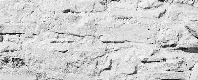 Texture background, pattern. The wall is lined with granite stones and whitewashed with lime. a continuous vertical brick or stone royalty free stock images Texture background, pattern. The wall is lined with granite stones and whitewashed with lime. a continuous vertical brick or stone royalty free stock images