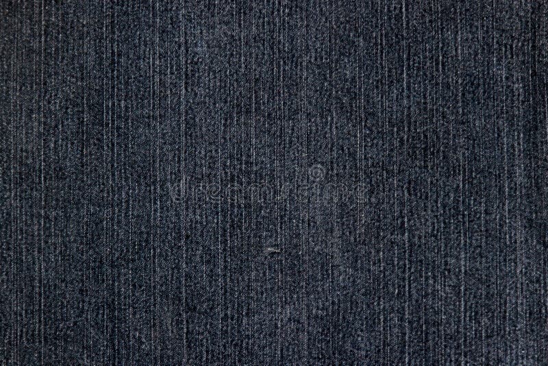 Texture of a Black Denim Fabric with a Decorative Yellow Topstitching