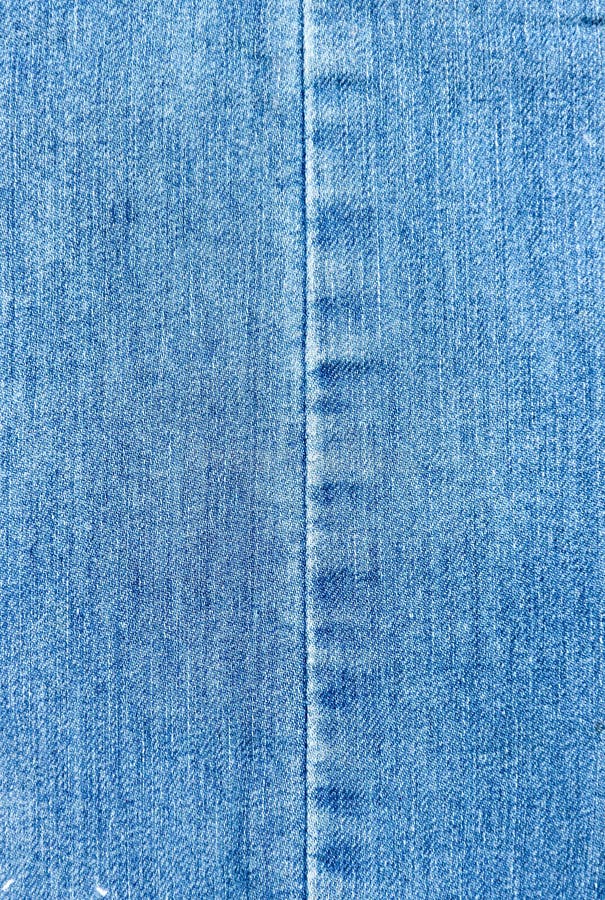 Texture of a Blue Denim Fabric. Two Pieces of Fabric Stitched Together ...