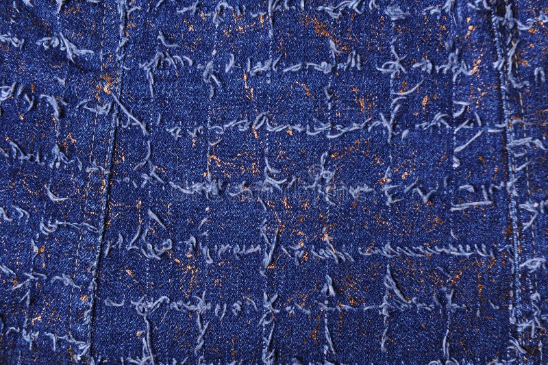 Texture de denim bleu avec des fils d'or photos stock Texture de denim bleu avec des fils d'or photos stock