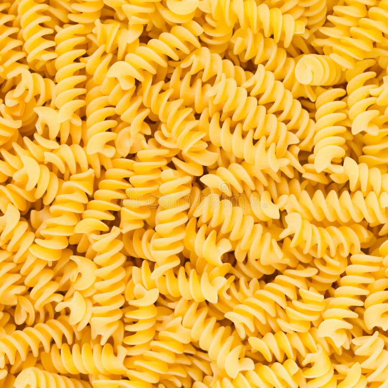 Texture de fond de nourriture de pâtes de macaronis d'Italien Fusilli, de Rotini ou de Scroodle
