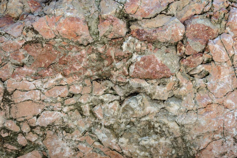 Texture de mur de vieux plan rapproché en pierre rouge endommagé images libres de droits Texture de mur de vieux plan rapproché en pierre rouge endommagé images libres de droits
