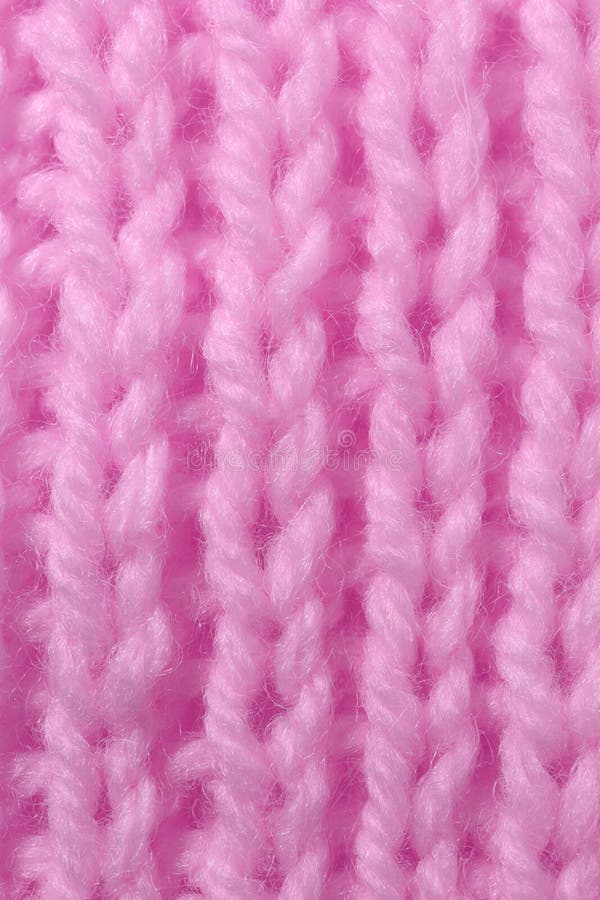 Texture de tricot de laine rose. Verticale à travers les lignes détaillées de tissage de capture. Fond de textile de chandail. Gros plan macro