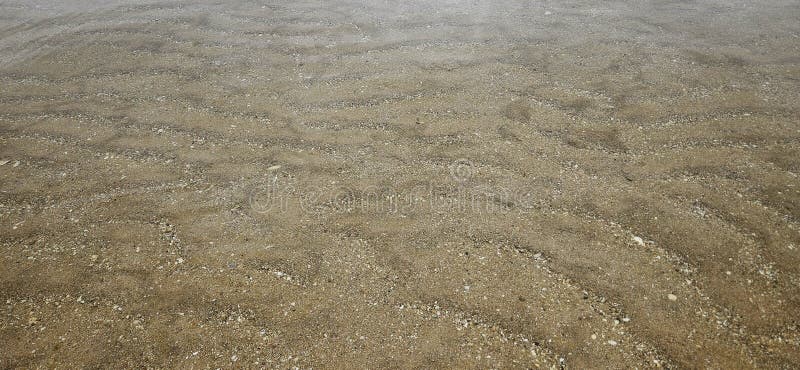 Texture des vagues océaniques sur la plage de sable dans le paysage de fond d'eau photos stock