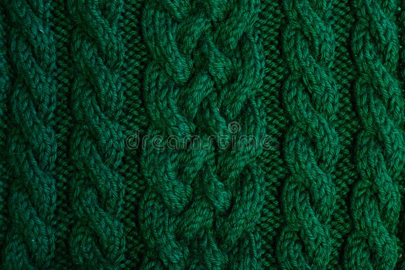 Texture des vêtements tricotés verts chauds d'hiver photographie stock libre de droits Texture des vêtements tricotés verts chauds d'hiver photographie stock libre de droits