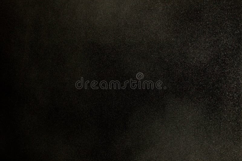 Texture of dust in the wind over black background