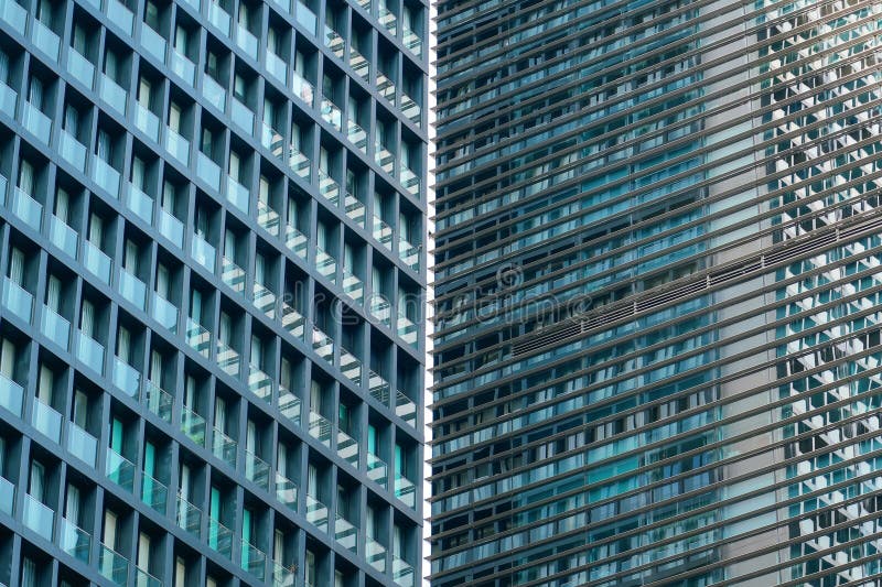 Texture facade features an intricate pattern of windows, reflective surfaces, and modern architectural design, capturing sunlight. Capturing sunlight stock images, royalty-free photos and pictures