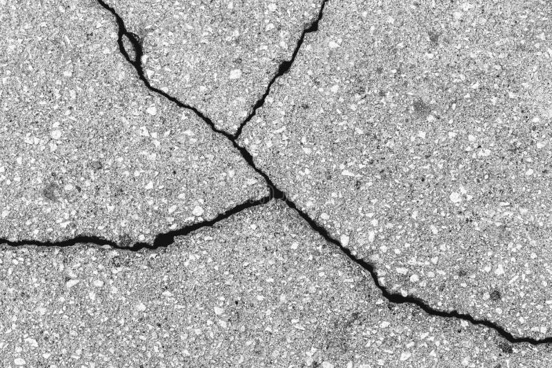 Texture fissurée d'asphalte gris. contexte abstrait. arrière-plan abstrait pour la conception.