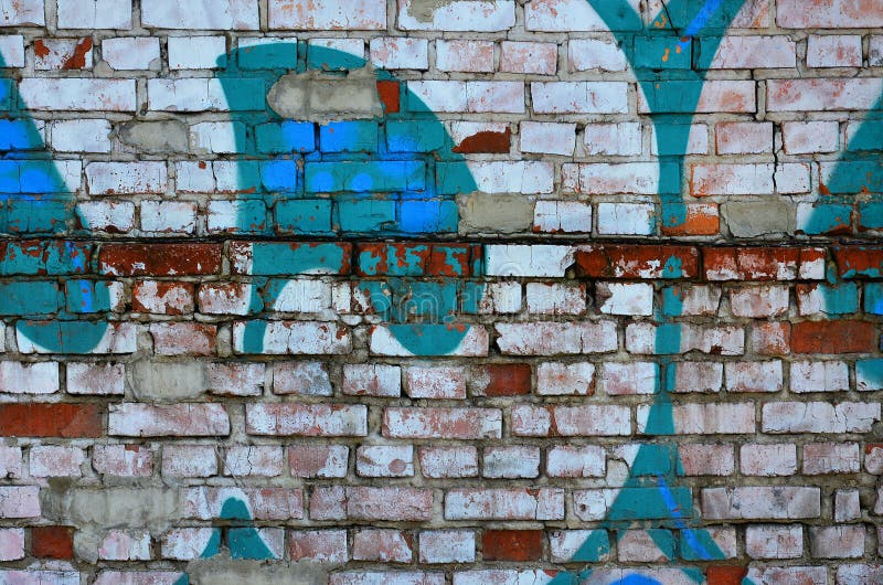 Fragment of an old wall with colorful graffiti painting