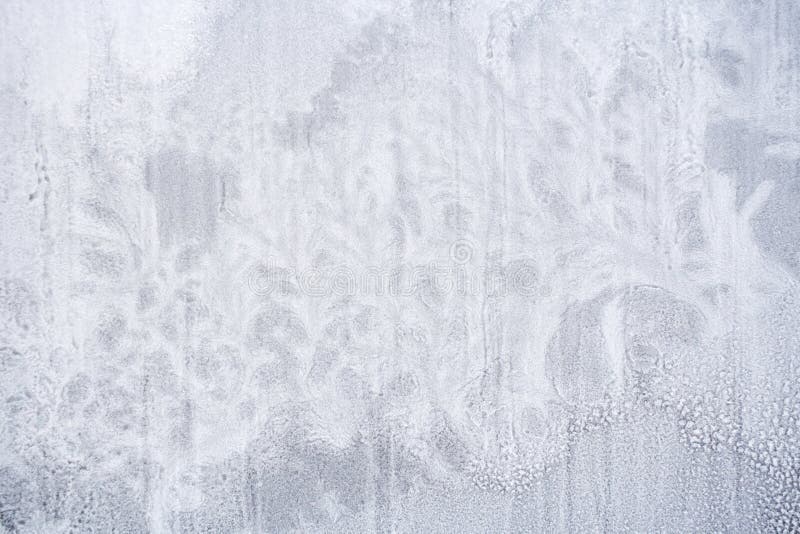 Texture of frozen snow on window glass in form of fantastic plants. stock images Texture of frozen snow on window glass in form of fantastic plants. stock images