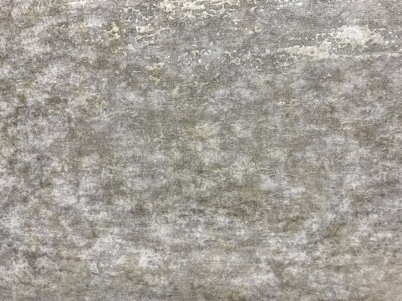 Texture of gray wallpaper with a pattern. Beige paper surface, structure closeup stock photography