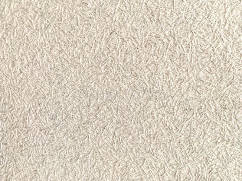 Texture of light beige wallpaper with a pattern royalty free stock images Texture of light beige wallpaper with a pattern royalty free stock images