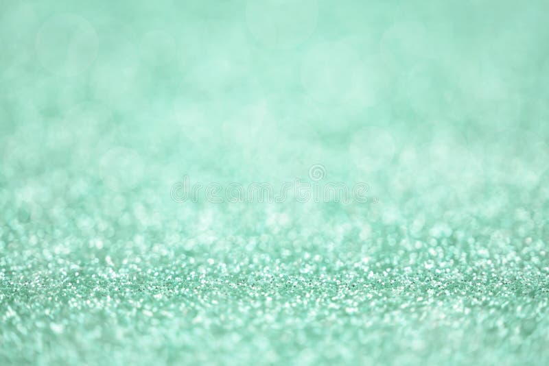 Green glitter surface with green light bokeh it can be used for background