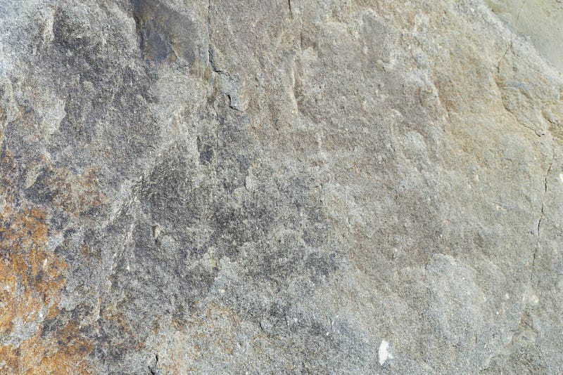 Texture of Natural Stone Gray. Background Stone in Nature Granite Gray with Rusty Stains Stock
