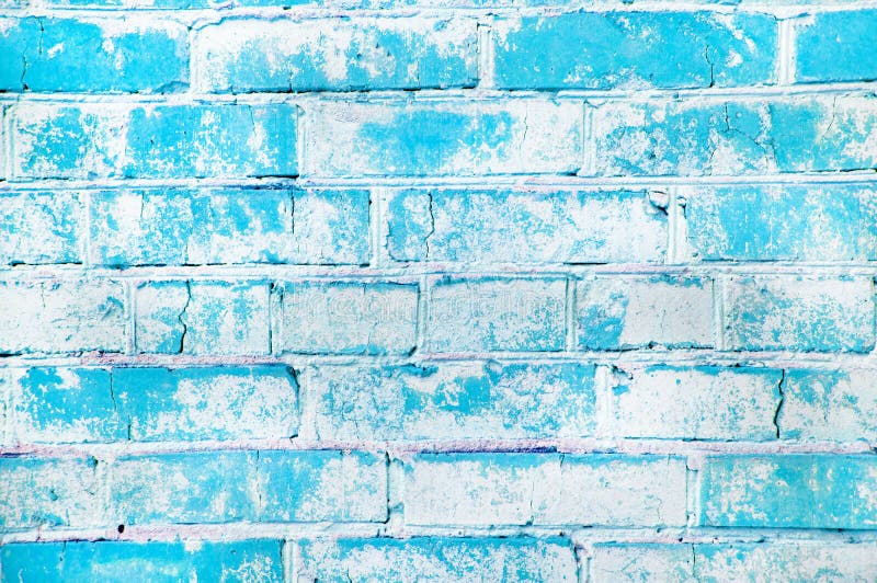 Texture of an old brick wall. Grunge blue stone wall background. Old masonry, shabby facade. Vintage brick wall