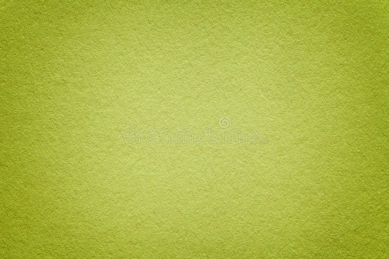 Texture of old green paper background, closeup. Structure of dense light olive cardboard royalty free stock photography