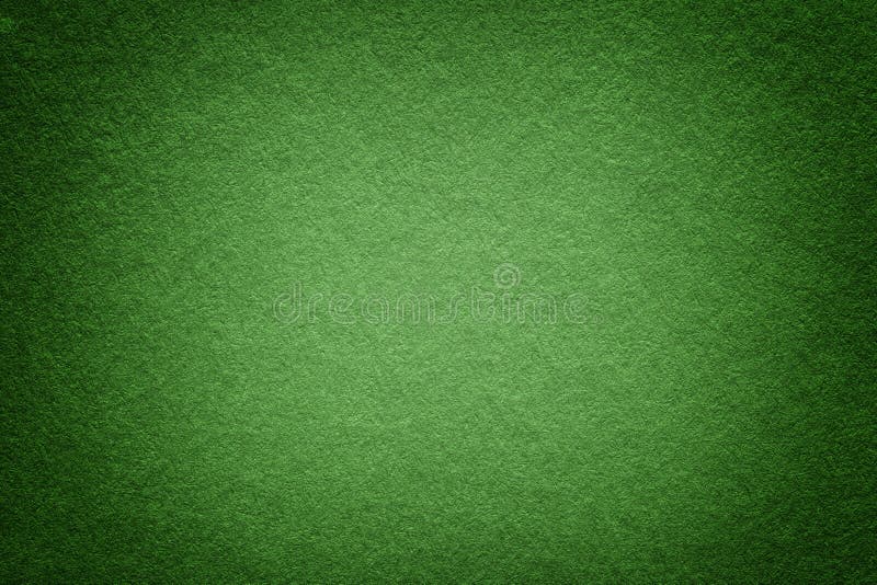 Texture of old green paper background, closeup. Structure of dense light olive cardboard stock photography