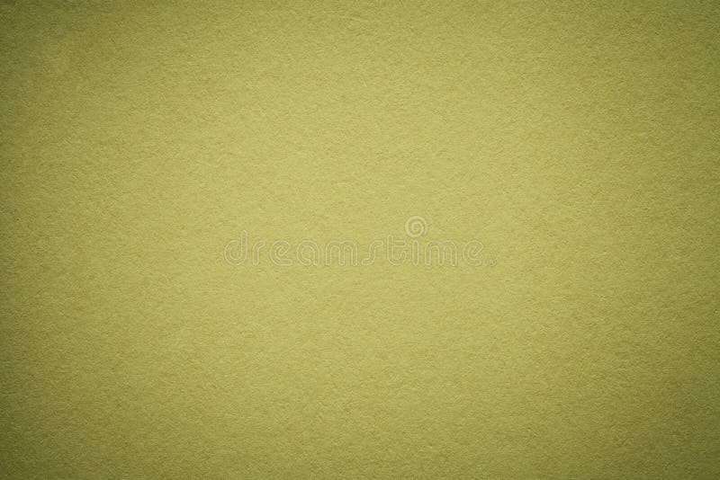 Texture of old olive paper background, closeup. Structure of dense light green cardboard. stock photography