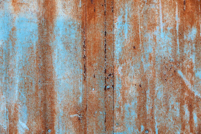 Old paint on rusty wall stock photo. Image of uneven 144689152