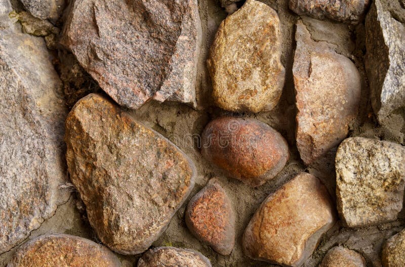 The texture of the old wall of large cobblestones. stock photo