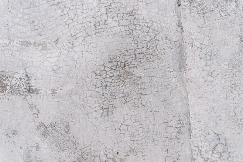 Texture of an old white wall with a lot of cracks royalty free stock photography