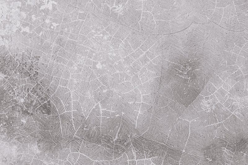 Texture of an old white wall with a lot of cracks stock photography