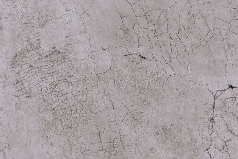 Texture of an old white wall with a lot of cracks stock image