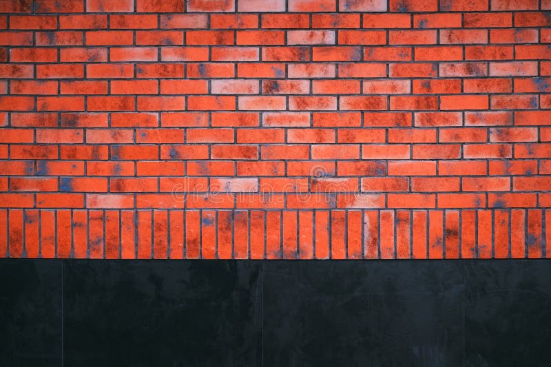 Texture of red brick wall with black concrete surface as background royalty free stock photo