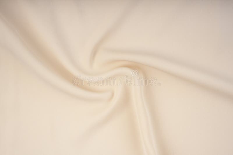 The Texture of the Satin Fabric of Beige Color for the Background Stock