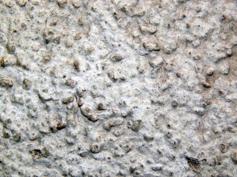 Texture of a surface of granular architectural putty stock images Texture of a surface of granular architectural putty stock images
