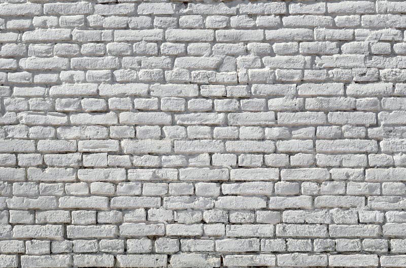 Texture of the wall of brick, painted white.