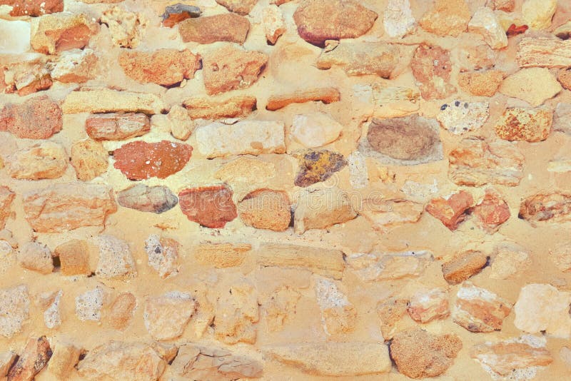 The texture of the wall of stones found during excavations stock photography